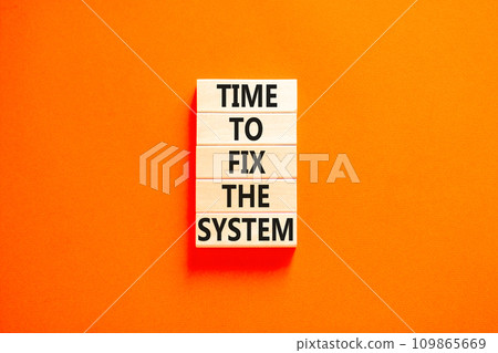 Time to fix the system symbol. Concept words Time to fix the system on wooden block. Beautiful orange table orange background. Business and time to fix the system concept. Copy space. 109865669