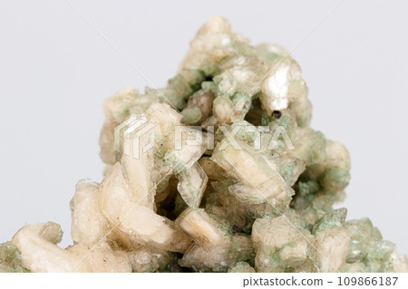 macro stone mineral stilbite on Apophyllite on a white background macro stone mineral stilbite on Apophyllite on a white background 109866187