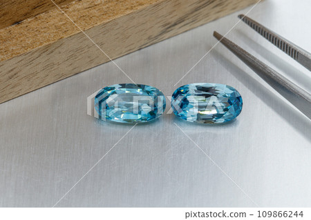 macro mineral faceted stone cut aquamarine on a gray background macro mineral faceted stone cut aquamarine on a gray background 109866244