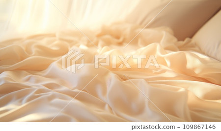 an elegant white sheet is on the bed with light shining on it an elegant white sheet is on the bed with light shining on it 109867146