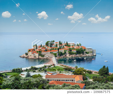 The morning view of Sveti Stefan sea islet with beach and town-hotel, Montenegro. People are unrecognizable. The morning view of Sveti Stefan sea islet with beach and town-hotel, Montenegro. People are unrecognizable. 109867575
