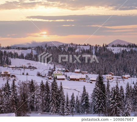 Pre-dawn alpine small quiet village and winter snowy mountains around Pre-dawn alpine small quiet village and winter snowy mountains around 109867667