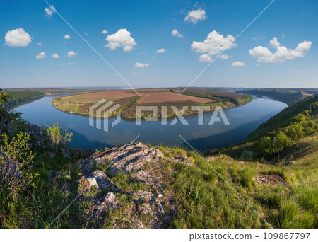 Amazing spring view on the Dnister River Canyon with picturesque rocks, fields, flowers. This place named Shyshkovi Gorby, Nahoriany, Chernivtsi region, Ukraine. Amazing spring view on the Dnister River Canyon with picturesque rocks, fields, flowers. This place named Shyshkovi Gorby, Nahoriany, Chernivtsi region, Ukraine. 109867797