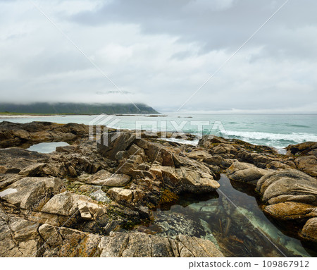 Ramberg beach summer cloudy view (Norway, Lofoten). Ramberg beach summer cloudy view (Norway, Lofoten). 109867912
