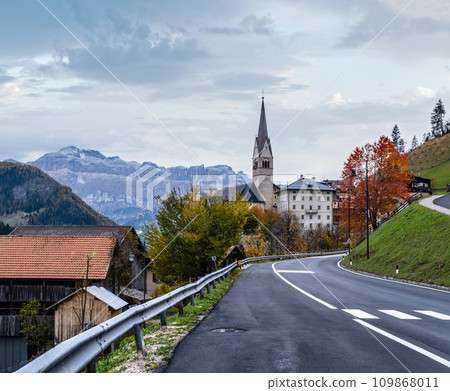 Autumn Dolomites village and old church, Livinallongo del Col di Lana, Italy. Autumn Dolomites village and old church, Livinallongo del Col di Lana, Italy. 109868011