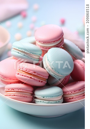 some pink and blue macarons are sitting on a white plate 109868518