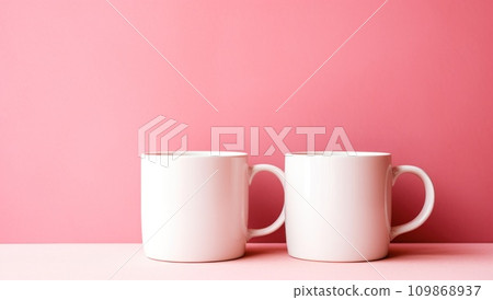 pink and white coffee mugs on a pink surface pink and white coffee mugs on a pink surface 109868937