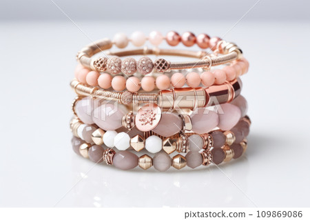 Stack of colorful bracelets adorned with charms. Generative AI 109869086