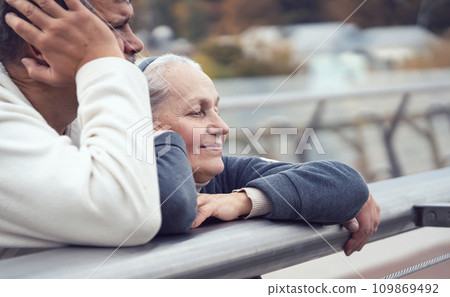 An elderly retired couple, a man and a woman walks and spends time together. 109869492