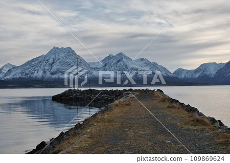 Breivikeidet Fergekai, Norway. Breivikeidet ferry dock in Norway. Fjord and mountains. 109869624