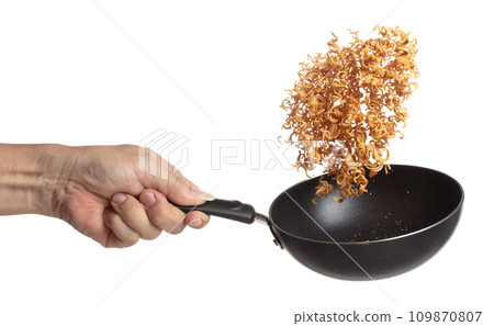 Instant Noodle fly in iron pan, yellow instant noodle float explode, abstract cloud fly. Curved dried instant noodles splash throwing in Air. White background Isolated high speed shutter, freeze Instant Noodle fly in iron pan, yellow instant noodle float explode, abstract cloud fly. Curved dried instant noodles splash throwing in Air. White background Isolated high speed shutter, freeze 109870807