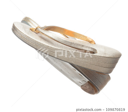 Tabis footwear shoes Japanese Traditional Komono equipment fly in air. Tabis footwear shoes Japanese Traditional Komono is beautiful clothes for ceremony event. White background isolated 109870819