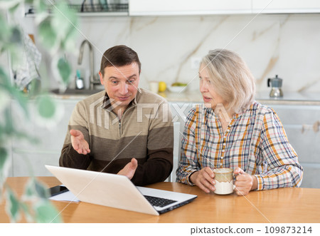 Old woman considering offer from agent 109873214