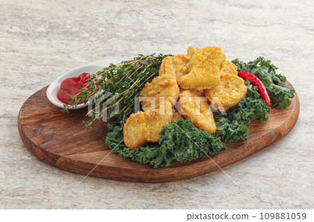 Crispy chicken nuggets with tomato ketchup Crispy chicken nuggets with tomato ketchup 109881059