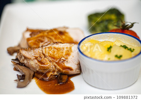 Gourmet Delight: Sliced Chicken with Mushroom Sauce and Mashed Potatoes Gourmet Delight: Sliced Chicken with Mushroom Sauce and Mashed Potatoes 109881372