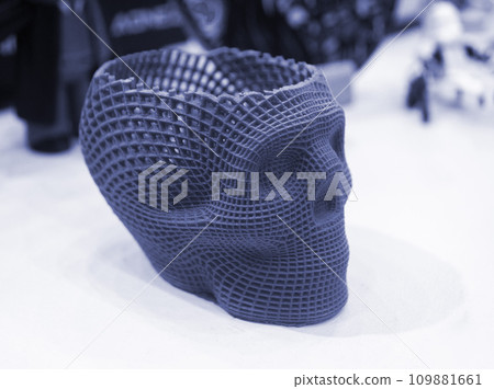 Prototype of human skull printed on 3D printer from molten purple plastic. Three-dimensional model skull 3D printed close-up. Additive progressive medical technology. Modern new printing manufacturing Prototype of human skull printed on 3D printer from molten purple plastic. Three-dimensional model skull 3D printed close-up. Additive progressive medical technology. Modern new printing manufacturing 109881661