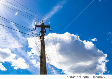 Power electric pole with line wire on colored background close up Power electric pole with line wire on colored background close up 109882702