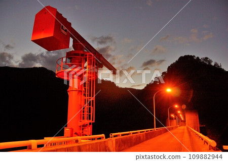 The crane at the top of Tainaigawa Dam illuminated at night The crane at the top of Tainaigawa Dam illuminated at night 109882944