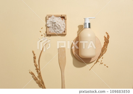 Rice bran is commonly used in the beauty industry. Cosmetic mockups displayed on a pastel background. Copy space for ads. Vegan cosmetics with rice bran extract. 109883850