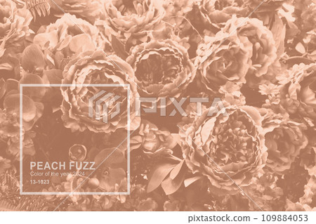 Handmade fabric flower close up Peach Fuzz color. Monochrome background with fabric craft flower. Trendy colour 2024 109884053