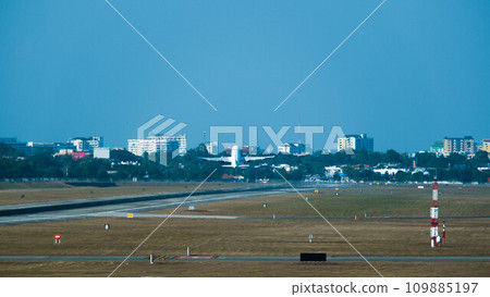 Airplane taking off from the airport. Plane on runway. Runway at the airport and the plane flies. 109885197