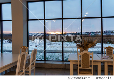 Winter sunset outside the window. Landscape outside the window Winter sunset outside the window. Landscape outside the window 109886613