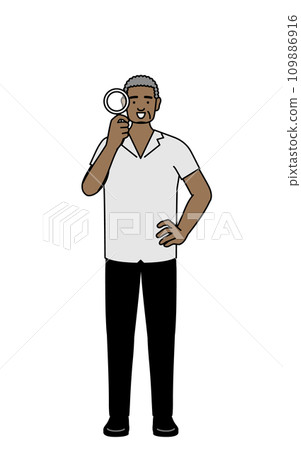 African senior man looking through a magnifying glass 109886916