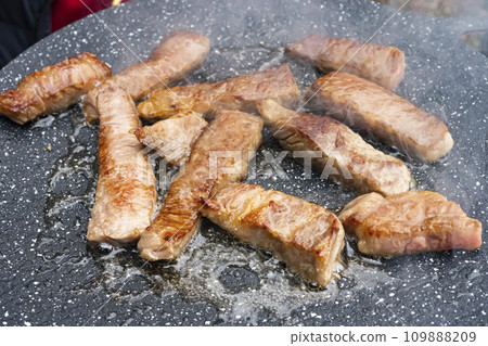 Yakiniku steak cooked on a multi-griddle Yakiniku steak cooked on a multi-griddle 109888209