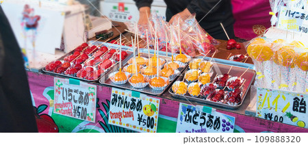 A variety of food and toy stalls that are only set up during festivals and other events. 109888320