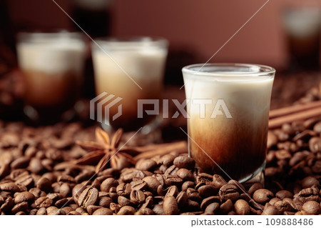 White Russian cocktail. Vodka, coffee liqueur, and cream. 109888486