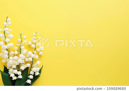 Lily of the valey bunch on yellow background top view 109889680