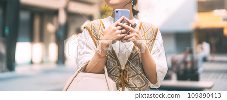 Casual business asian woman using smartphone city lifestyles with modern technology Casual business asian woman using smartphone city lifestyles with modern technology 109890413