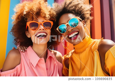 cute women wearing sun glasses posing in yellow cute women wearing sun glasses posing in yellow 109890835