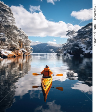 kayaker paddles down loch ness in snow and ice kayaker paddles down loch ness in snow and ice 109890872