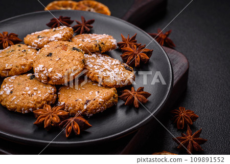 Delicious sweet round sponge cookies sprinkled with coconut flakes Delicious sweet round sponge cookies sprinkled with coconut flakes 109891552