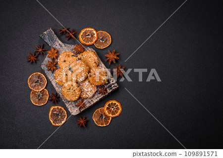 Delicious sweet round sponge cookies sprinkled with coconut flakes Delicious sweet round sponge cookies sprinkled with coconut flakes 109891571