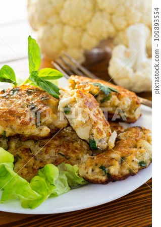 cooked vegetarian fried cauliflower cutlets in a plate cooked vegetarian fried cauliflower cutlets in a plate 109893554