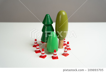 A forest surrounded by traffic cones. Preserving the environment and forest protection. Environmentally friendly and natural. Afforestation planting, combating climate change 109893705