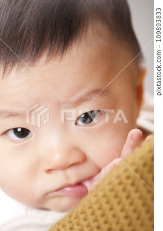 asian baby boy lying on bed asian baby boy lying on bed 109893833