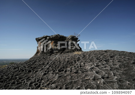 Stone texture with dark blue sky Stone texture with dark blue sky 109894097
