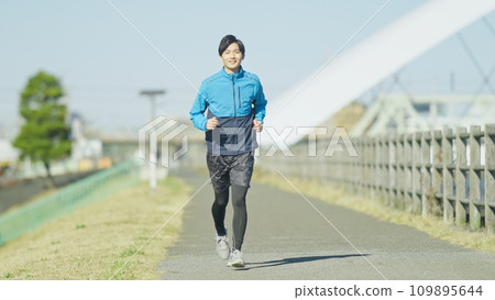 young man jogging on the bank 109895644