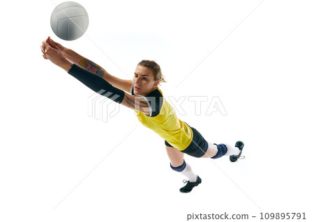 Dynamic competitive young woman, volleyball player in motion during game, hitting ball isolated over white background. Sport, active and healthy lifestyle Dynamic competitive young woman, volleyball player in motion during game, hitting ball isolated over white background. Sport, active and healthy lifestyle 109895791
