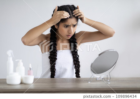 Dandruff Problem. Upset Young Indian Woman Looking To Mirror At Her Hair Roots, 109896434