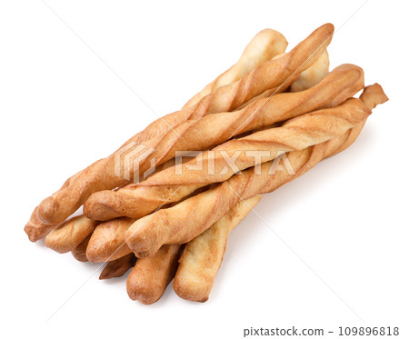 Pile of grissini breadsticks close-up on a white background. Isolated 109896818