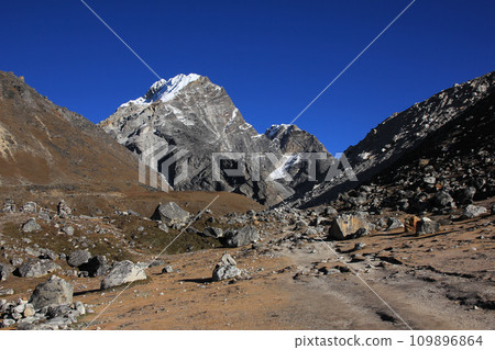 Foot path leading towards Lobuche and Mount Lobuche East, Nepal. 109896864