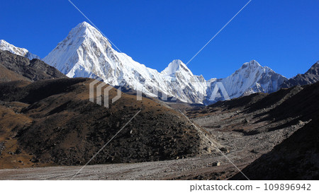 White painted Mount Pumo Ri and distant view of the Everest Base Camp, Nepal. White painted Mount Pumo Ri and distant view of the Everest Base Camp, Nepal. 109896942