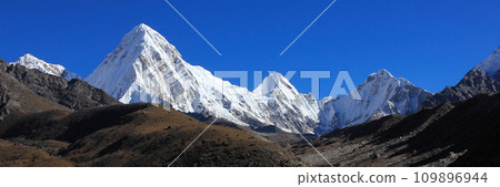White painted Mount Pumo Ri and distant view of the Everest Base Camp, Nepal. White painted Mount Pumo Ri and distant view of the Everest Base Camp, Nepal. 109896944