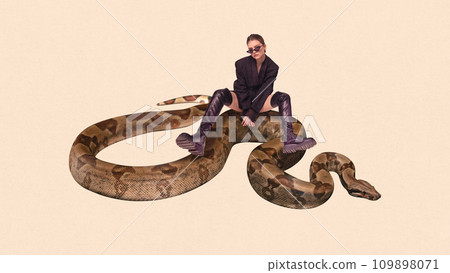 Contemporary art collage. Elegance and beauty in wild. Young cool attitude girl sitting on huge snake, python against peach color background. Contemporary art collage. Elegance and beauty in wild. Young cool attitude girl sitting on huge snake, python against peach color background. 109898071