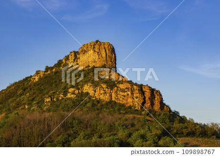 Rock of Solutre with vineyards, Burgundy, Solutre-Pouilly, France 109898767
