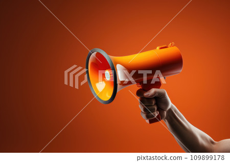 Megaphone in hand on a orange background, attention concept announcement 109899178